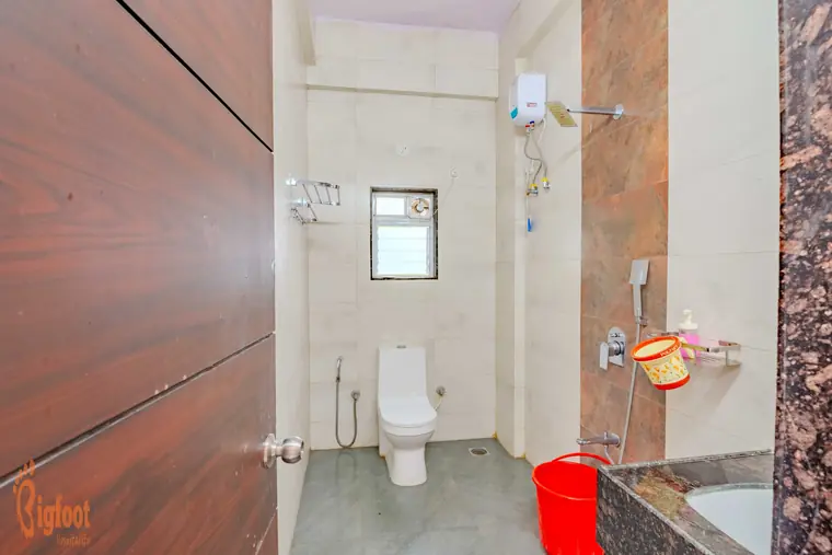 Bathroom with hot water geyser at Hideaway Villa