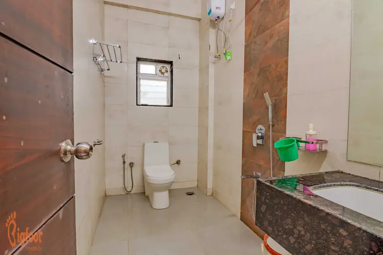Attached ensuite bathroom at Hideaway Villa with hot water geyser