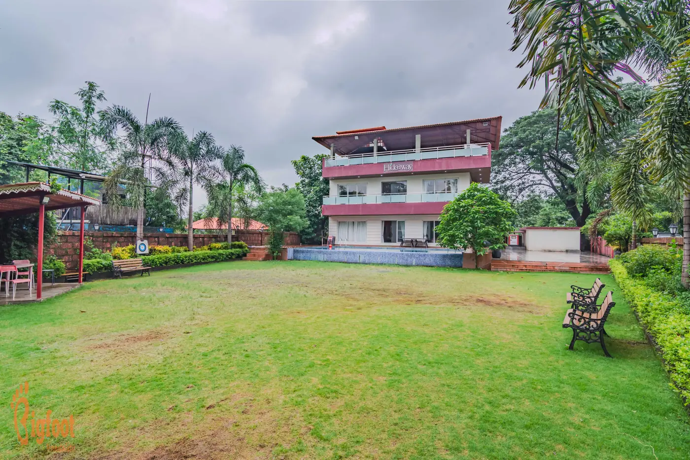 The lawn and garden surrounding Hideaway Villa in Karjat