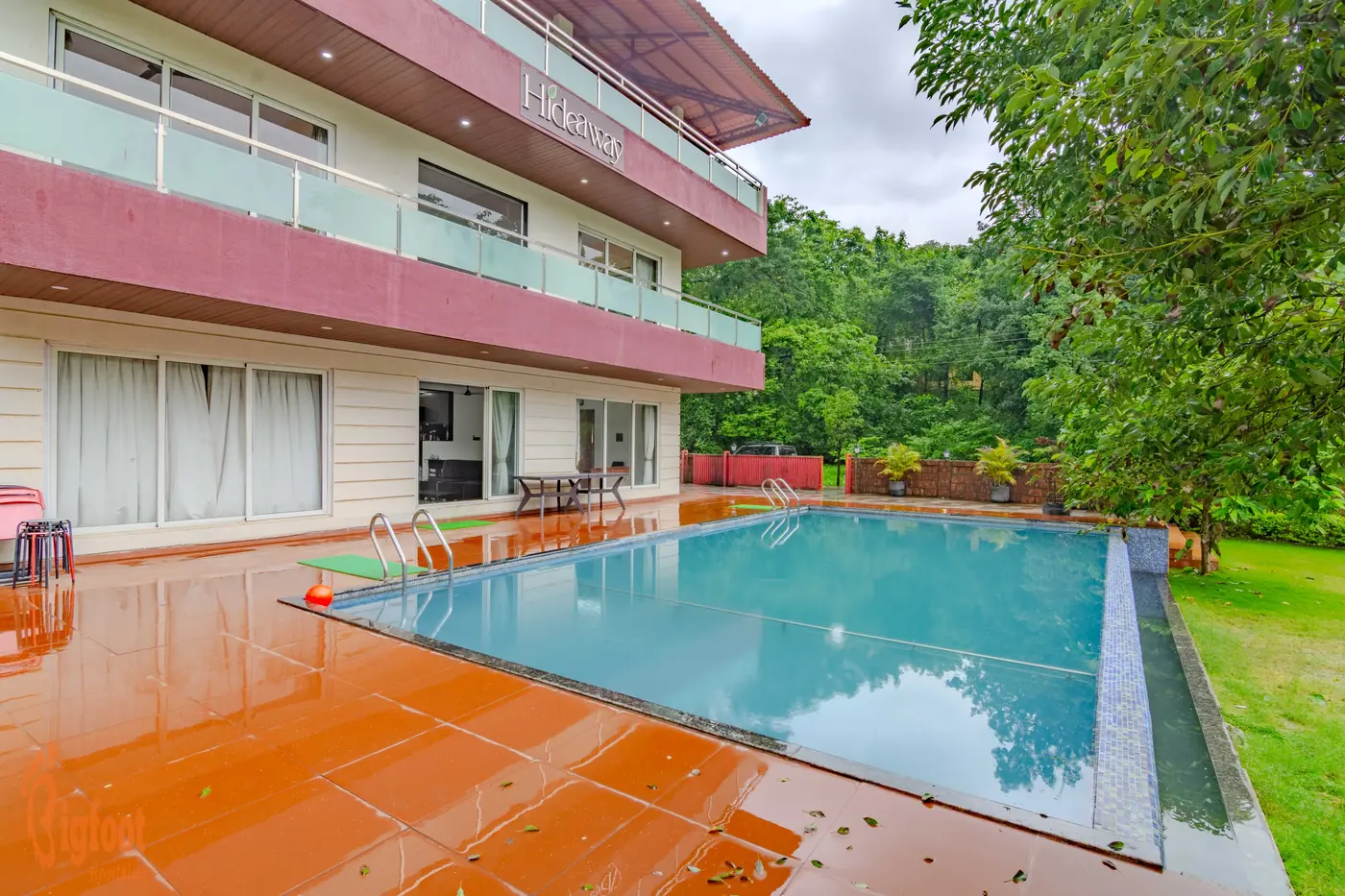 The pool deck at Hideaway Villa in Karjat
