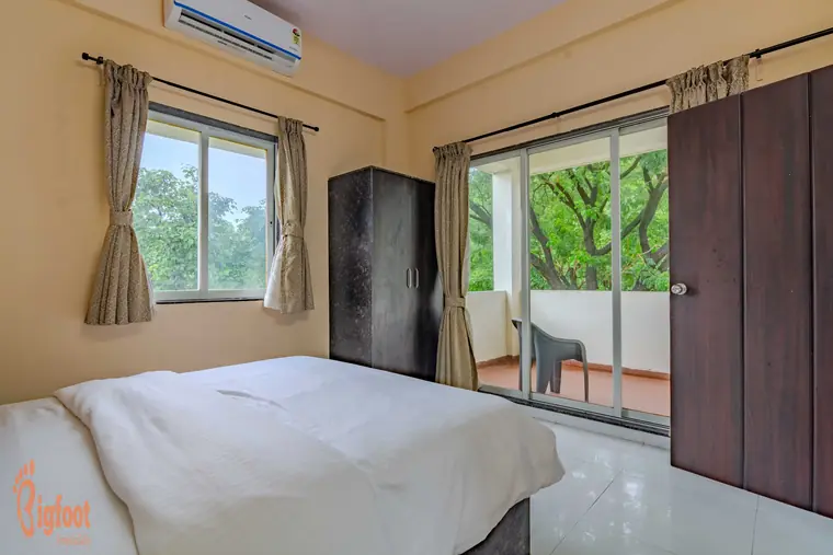 Bedroom at Hideaway Villa with a sliding door to the terrace